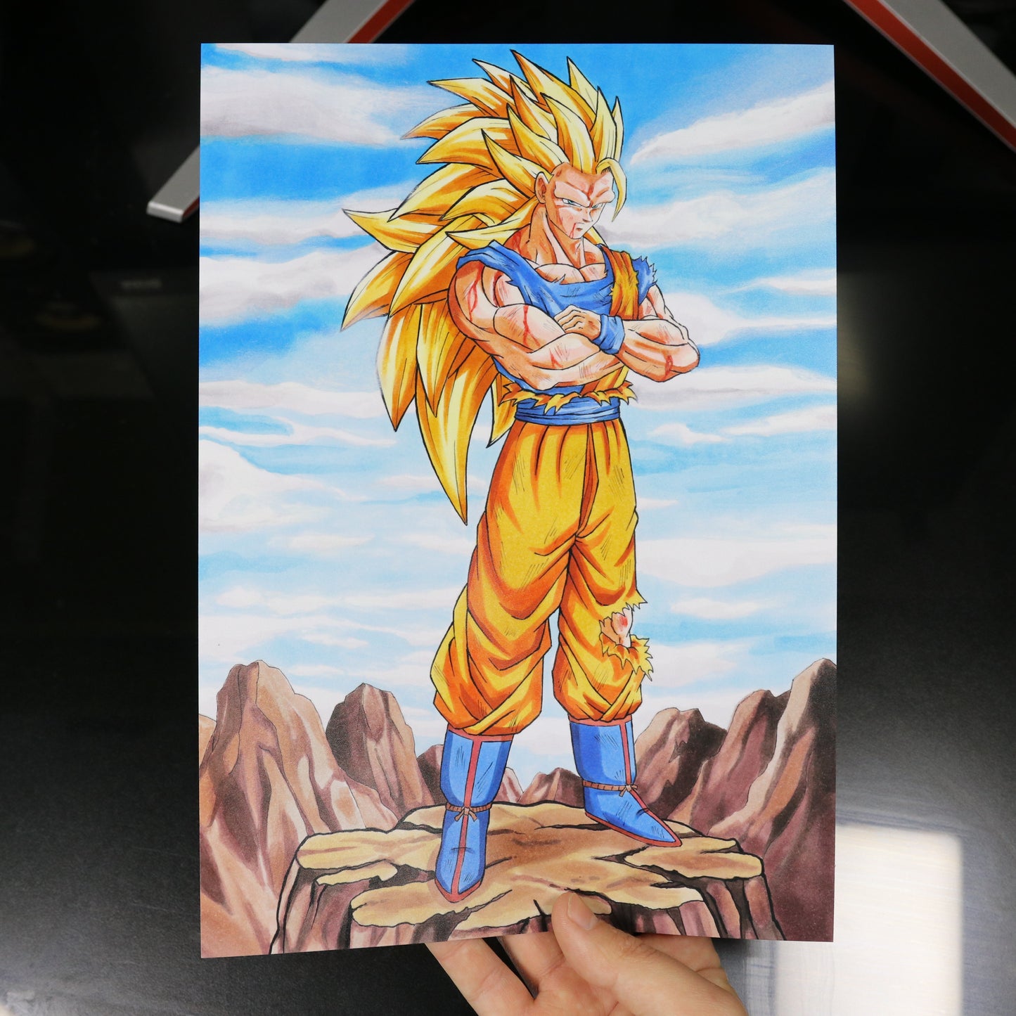 Print de Goku Super Saiyan 3 con fondo de rocas